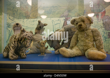 The original Winne the Pooh stuffed toy animals in a glass display case in New York Public Library Stock Photo