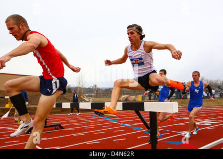 March 16, 2013 - Boulder, CO, United States of America - March 16, 2013: Metropolitan State's Eiger Erickson clears a hurdle just ahead of Kyle O'Brien from the Boulder Track Club in the steeple chase at the inaugural Jerry Quiller Classic at the University of Colorado campus in Boulder. Erickson won the event. Stock Photo