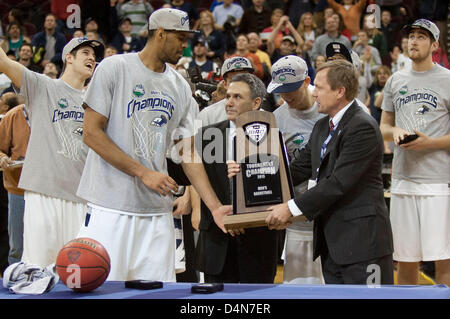 March 16, 2013: Akron head coach Keith Dambrot and Zeke Marshall accept the MAC Tournament Championship trophy after Akron beat Ohio 65-46 at Quicken Loans Arena in Cleveland, OH. Stock Photo