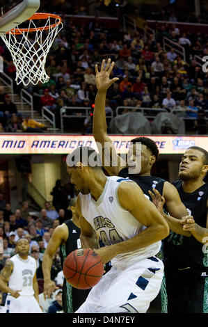 March 16, 2013: Zeke Marshall (44) of Akron is defended by two Ohio Bobcats during the MAC Tournament Championship game. Akron beat Ohio 65-46 at Quicken Loans Arena in Cleveland, OH. Stock Photo