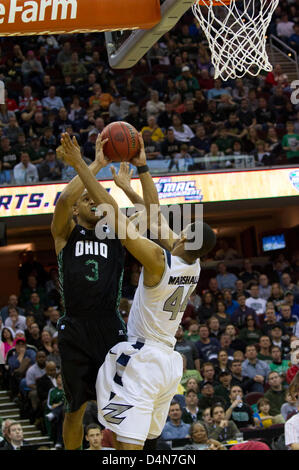 March 16, 2013: Walter Offutt (3) of Ohio shoots over Akron's Zeke Marshall (44) during the MAC Tournament Championship game. Akron beat Ohio 65-46 at Quicken Loans Arena in Cleveland, OH. Stock Photo