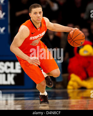 March 16, 2013 - New York, New York, U.S. - March 16 2013: Syracuse guard Brandon Triche (20) brings the ball up court inn the second half during the Big East Championship game between the Louisville Cardinals and the Syracuse Orange at Madison Square Garden in New York City. Louisville defeated Syracuse 78-61. Stock Photo