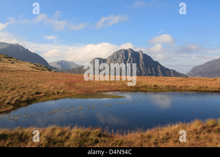 Mt Tryfan mountain east face across Nant yr Ogof with boggy upland pool in Snowdonia National Park Conwy North Wales UK Britain Stock Photo