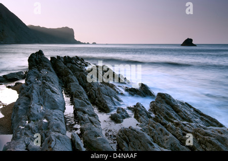 Dawn light over Dungy Head from Man O War Bay, Dorset. Stock Photo