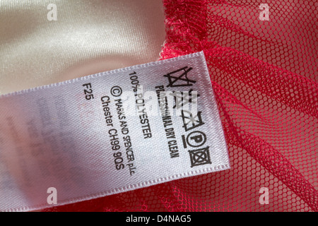 label with washing instructions - professional dry clean 100% polyester - Care washing symbols and instructions Stock Photo