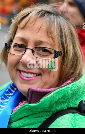 March 16, 2013 - New York, NY, U.S. - RITA NAPIERKOWSKI, of Wallingford, CT, with  shamrock on her cheek, is marching in the 252nd annual NYC St. Patrick’s Day Parade. Thousands of marchers show their Irish pride, as they march up Fifth Avenue, and over a million people, often in green and orange, watch and celebrate. Stock Photo
