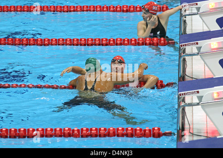 Natalie du Toit of South Africa after winning gold congratulated by Stephanie Millward GB in the Women's 200m Ind. Medley - SM9 Stock Photo