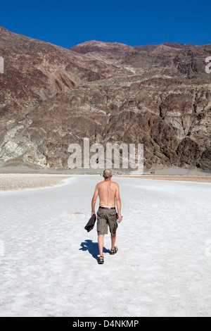 Walking in the heat at Bad Water Basin the hottest place on earth, Bad Water, Death Valley, California, USA Stock Photo