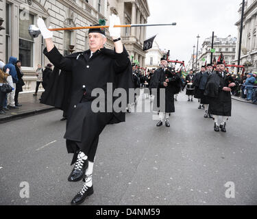 Essex Caledonian Pipe Band march on the St Patrick's Day Parade on 17/03/2013 at Westminster, London. The parade set off from Piccadilly by Green Park at 12 noon and traveled to Whitehall.  A main attraction was The Puca, a giant inflatable dragon designed by leading artist Keith Payne. Picture by Julie Edwards Stock Photo