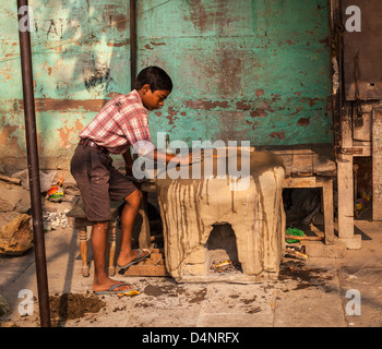 Indian boy, working on his own, Uttar Pradesh, India Stock Photo