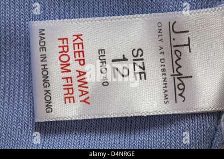 label in J.Taylor only at Debenhams garment - Keep away from fire Made in Hong Kong - sold in the UK United Kingdom, Great Britain Stock Photo