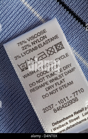 label showing washing instructions in garment - 100% nylon with PU ...