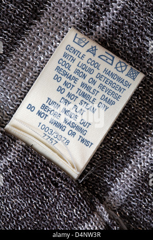 label showing washing instructions in garment - care washing symbols and instructions Stock Photo