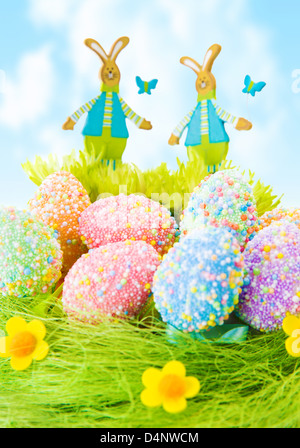 Colorful Easter eggs, beautiful painted eggs on the grass, diversity of traditional decorations for Christian spring holiday Stock Photo