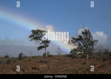 Rainbow over Old lava flow Kilauea Volcanoes National Park Hawaii the big island Stock Photo
