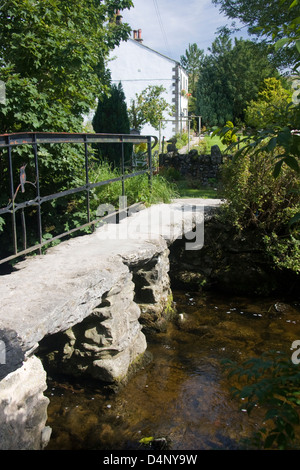 Clapper bridge over Malham Beck, Yorkshire, England Stock Photo