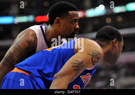 Tattoos on the legs of Dallas Mavericks center DeAndre Jordan (6