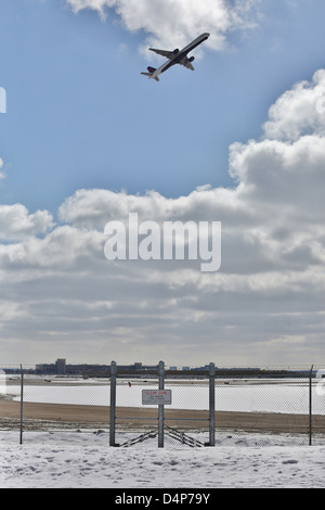A security fence surrounding an airport. Stock Photo
