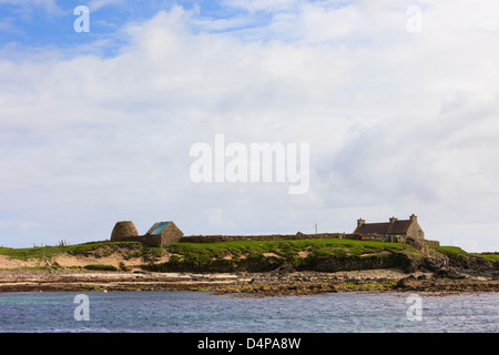 Broch and stone building by Visitors Centre on Isle of Noss National Nature Reserve, Shetland Islands, Scotland, UK, Britain Stock Photo