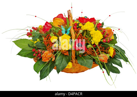 Flower bouquet arrangement centerpiece in a wicker gift basket isolated on white background. Stock Photo