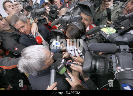 Formula 1 supremo Bernie Ecclestone (L) talks to journalists at the Silverstone Circuit in Northamptonshire, Great Britain, 19 June 2009. The Formula 1 British Grand Prix will take place on 21 June 2009. Photo:  Jens Buettner Stock Photo