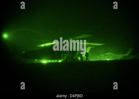 A photo released by the US Marine Corps shows Marines from the 1st Battalion, 5th Marine Regiment, Regimental Combat Team 3 and the Marine Expeditionary Brigade-Afghanistan, who prepare to board a UH-60L Black Hawk helicopter during the launching of Operation Khanjar in the Helmand province, Afghanistan, 02 July 2009. Marines, Afghan soldiers and police forces launched a large-scal Stock Photo