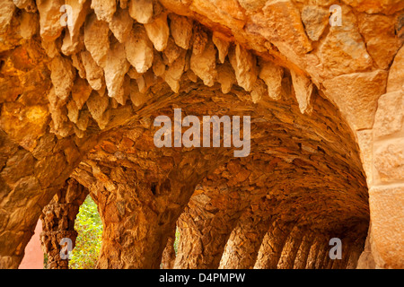 Colonnaded Footway Under Viaduct designed by Antoni Gaudi Guell Park, Barcelona, Catalonia, Spain Stock Photo