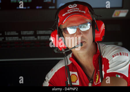 German Michael Schumacher, seven-time Formula One World Champion and adviser for Scuderia Ferrari, pictured in the pits during the first practice session at the street circuit in Valencia, Spain, 21th August 2009. The Formula 1 Grand Prix of Europe will take place on 23 August 2009. Photo: FELIX HEYDER