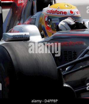 British Lewis Hamilton steers his McLaren-Mercedes during a practice ...