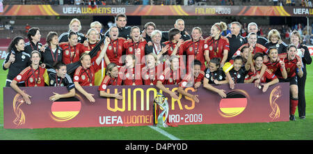 The German team poses with the cup after the UEFA Women?s EURO 2009 final match England vs Germany at Olympic Stadium in Helsinki, Finland, 10 September 2009. The 6-2 victory brought the German team the seventh consecutive European Championship title. Photo: Carmen Jaspersen Stock Photo
