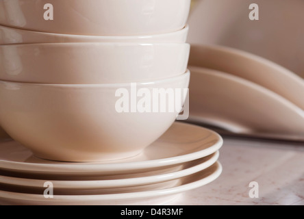 Stack of clean cookware in kitchen. Stock Photo