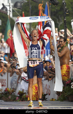 British athlete Chrissie Wellington crosses the finish line at the Ironman Triathlon World Championships in Kailua-Kona, Hawaii, USA, 10 October 2009 (local time). She set up a new course record. Photo: Thomas Frey Stock Photo