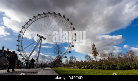London Eye from the park in a sunny and cloudy day Stock Photo