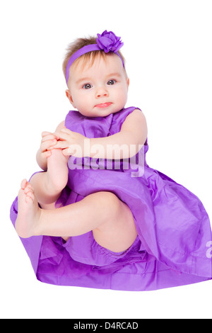 Cute Adorable Girl Baby Is Looking Up Wearing Purple Dress Cute