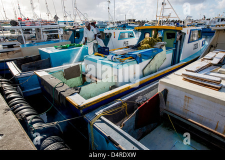 trawlers and fishing boats line the quay at Bridgetown fish market, Barbados, Caribbean Stock Photo