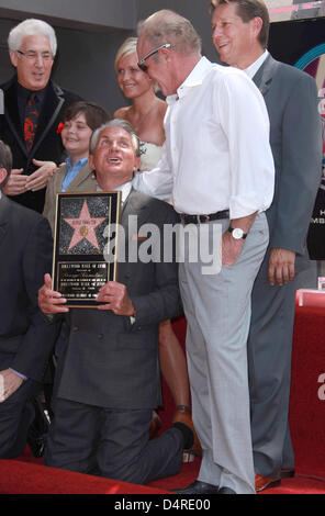 US actor George Hamilton (C), his son George ?GT? Hamilton (2-L), his German girlfriend Dr. Barbara Sturm (3-L) and actor James Caan (2-R) pose next to Hamilton?s star during the ceremony for his new star on the Hollywood Walk of Fame in Los Angeles, USA, 13 August 2009. Hamilton?s best known films include the ?The Godfather: Part III? and ?Crocodile Dundee?. Photo: Hubert Boesl Stock Photo