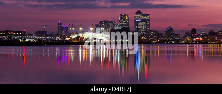 Canary Wharf and O2 Arena sunset with reflection in the water Stock Photo