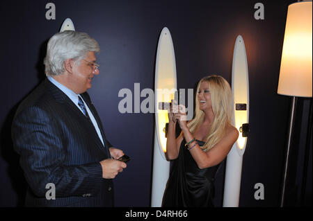 Mike Lazaridis, BlackBerry inventor, and actress Tara Reid attend the BlackBerry launch party at Kameha Suite in Cologne, Germany, 21October 2009. Canadian inventor and producer Research In Motion® (RIM) started to further develop smartphones in Germany one year ago. The BlackBerry smartphones ?developed in Germany? were celebrated at the party. Photo: Joerg Carstensen Stock Photo