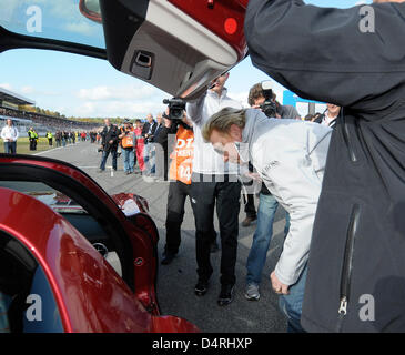 Former German professional tennis player Boris Becker gets in a car prior to the the last race of the season of the ?Deutsche Tourenwagen Masters? (DTM, German Touring Car Masters) at the Hockenheimring in Hockenheim, Germany, 25 October 2009. Photo: Ronald Wittek Stock Photo