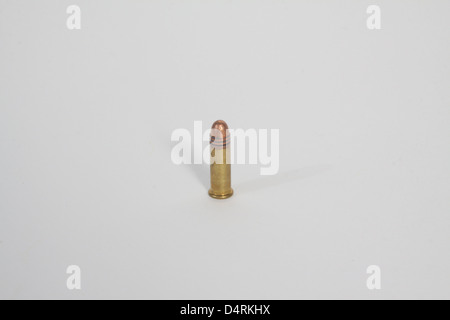 .22 ammunition,  a small caliber bullet on a light colored background Stock Photo