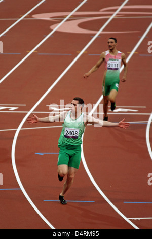 Jason Smyth of Ireland celebrates gold in the mens 100m - T13 in the Olympic stadium at the London 2012 Paralympic games. Stock Photo