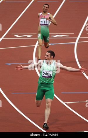 Jason Smyth of Ireland celebrates gold in the mens 100m - T13 in the Olympic stadium at the London 2012 Paralympic games. Stock Photo