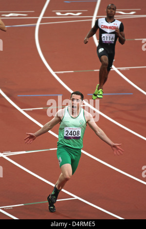 Jason Smyth of Ireland celebrates gold in the mens 100m - T13 in the Olympic stadium at the London 2012 Paralympic games. Stock Photo