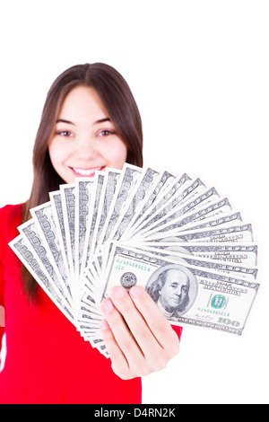 Money In Teenager Hands, Teenager holding and showing all one hundred dollar banknotes in her red shirt with a sweet smile. Stock Photo