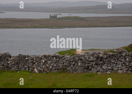 A ruined crofters cottage sits on an isolated peninsula Isle of Lewis, Outer Hebrides, Scotland, Standing Stones of Callanish, Stock Photo