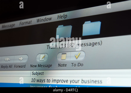 Close up of  an Apple Imac screen showing the mail window, focusing on trash with 33182 messages. Stock Photo