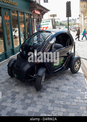 A Renault Twizzy on the street in Honfleur, France. Outside a Pharmacy, signwritten. Stock Photo