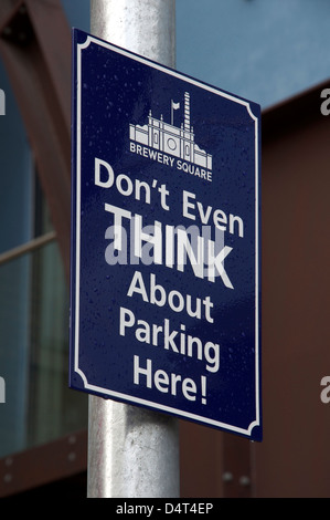 “Don’t even think about parking here!”. A quirky humorous No Parking sign at Brewery Square in Dorchester, Dorset, England, United Kingdom. Stock Photo