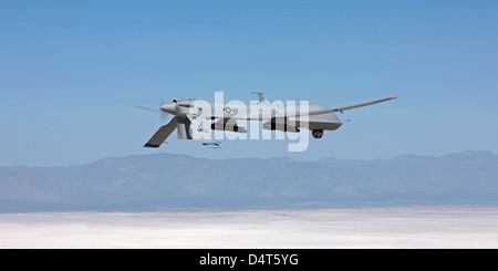 An MQ-1 Predator flies a training mission over the White Sands National Monument in Southern New Mexico. Stock Photo