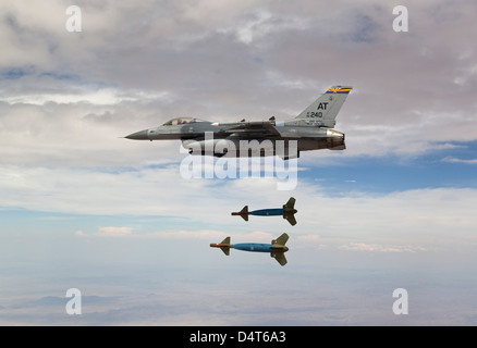 An F-16 Fighting Falcon releases two GBU-24 laser guided bombs. Stock Photo